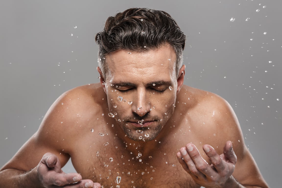 Handsome Mature Man Washing His Face.